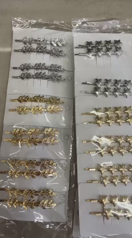 Grampos metal estrelinhas (12 cartelas com 2 peças cada 10 dourada e 2 pratas)