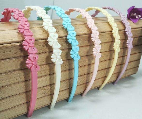 Tiara Infantil Poliéster com dentinhos LAÇOS (12 peças)