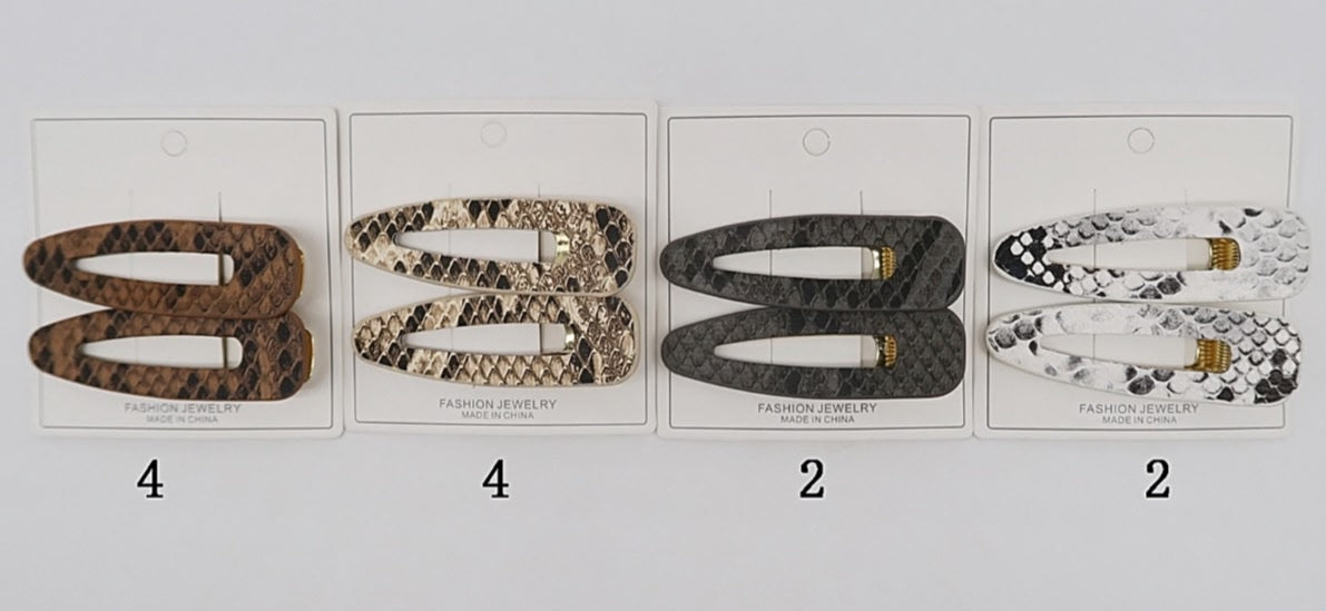Hair clip estampa cobra (12 cartelas com 2 peças cada)