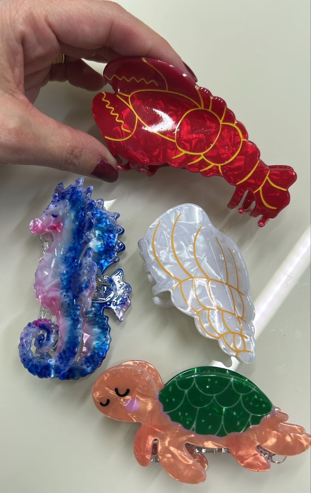 Pregadeira m acetato com elementos do mar (12 peças 3 de cada tema)