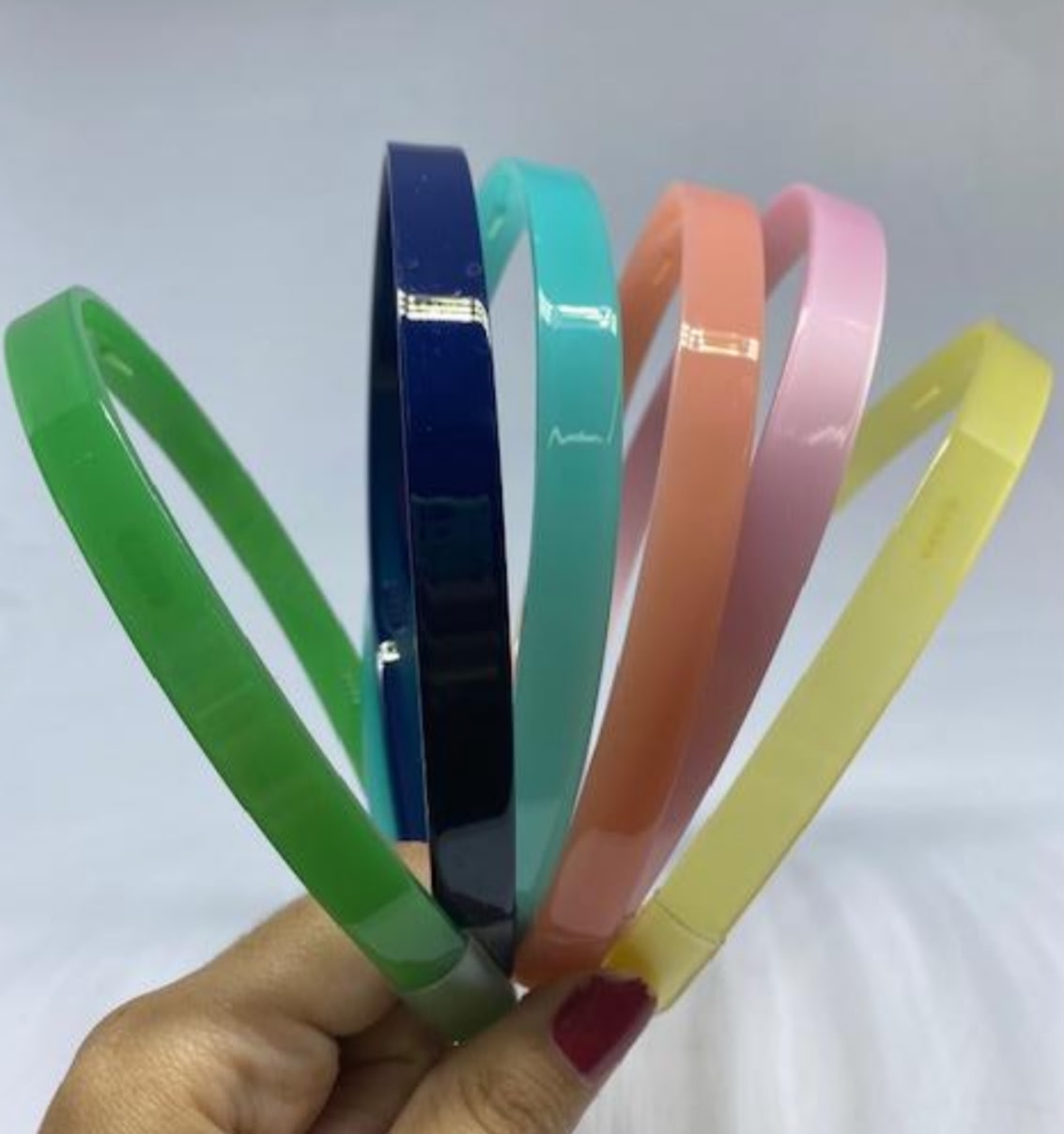 Tiara acetato liso com dentinhos colorida (12 peças 2 de cada cor)
