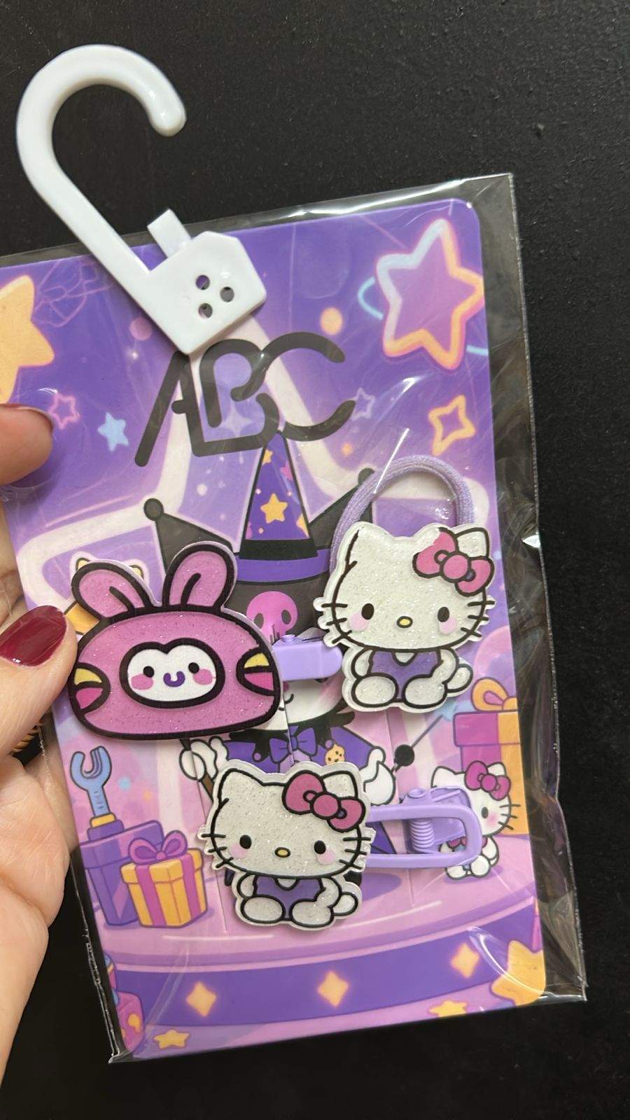 Kit hair clip e xuxinhas hello kitty lilás (12 cartelas com 4 peças cada)
