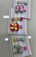 Hair clip borboleta e trio florzinhas (12 cartelas com 2 peças cada)